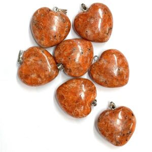 Pile of Orchid Calcite Heart Pendants